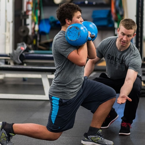 Image of a saltus performance coach training a youth for long-term athletic development.