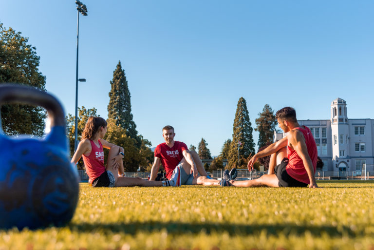 An image of the saltus team stretching after a workout