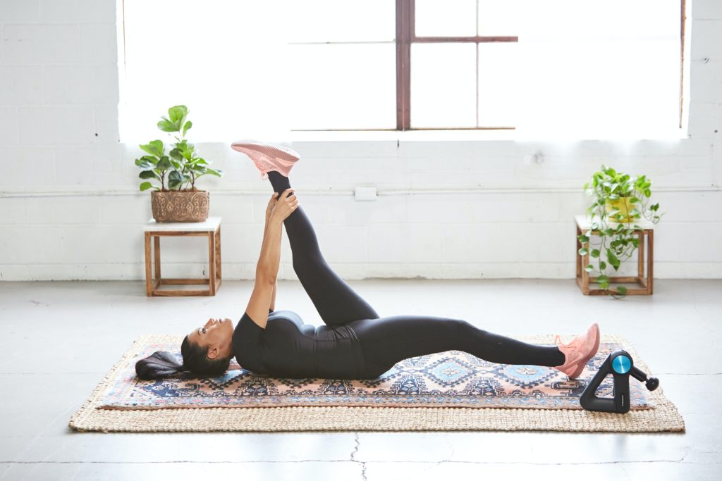 Image of a woman stretching for recovery