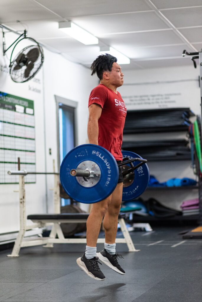 Saltus Athlete performing a loaded jump for explosive training