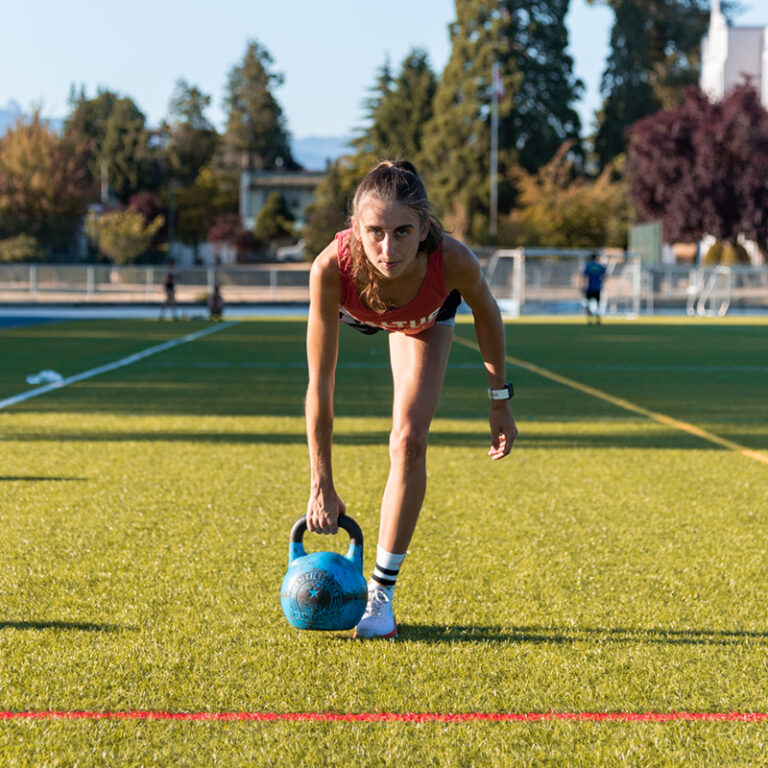 Saltus Athlete doing a kettlebell exercise for stronger legs for running