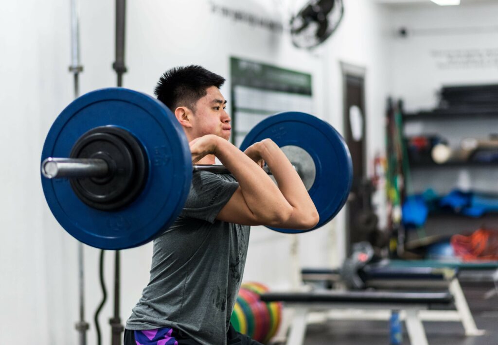 A man doing an Olympic lift at Saltus Performance