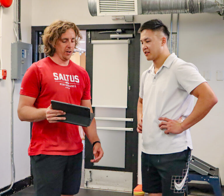 A trainer coaching a client at Saltus Performance