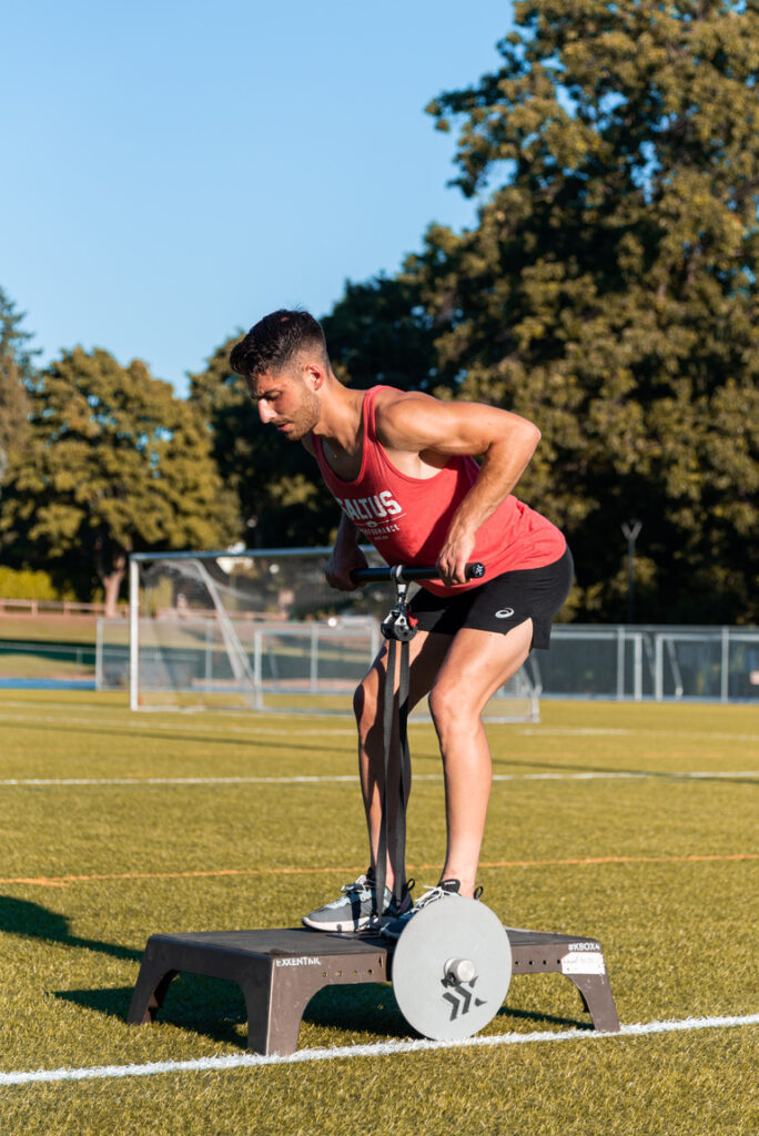 Athlete at Saltus Performance performing flywheel training